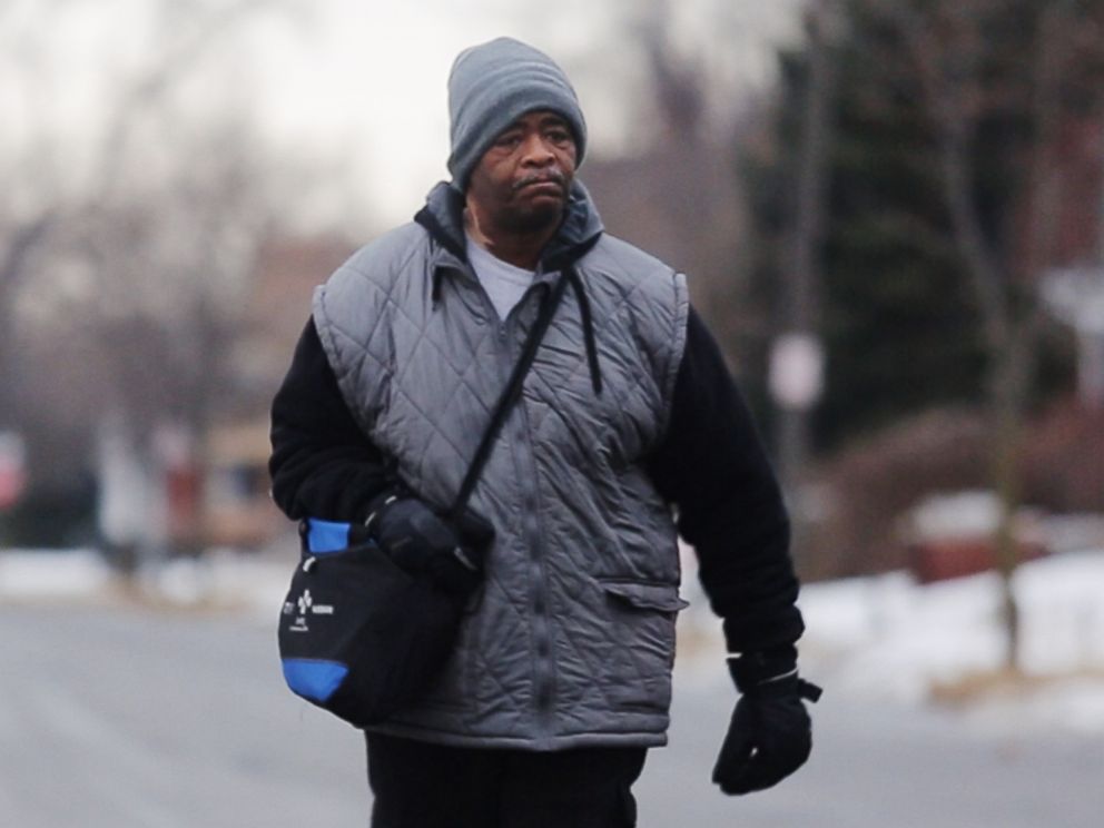 PHOTO: In this Jan. 29, 2015, photo, James Robertson toward Woodward Aveune in Detroit to catch his morning bus to Somerset Collection in Troy before walking to his job at Schain Mold & Engineering in Rochester Hills.