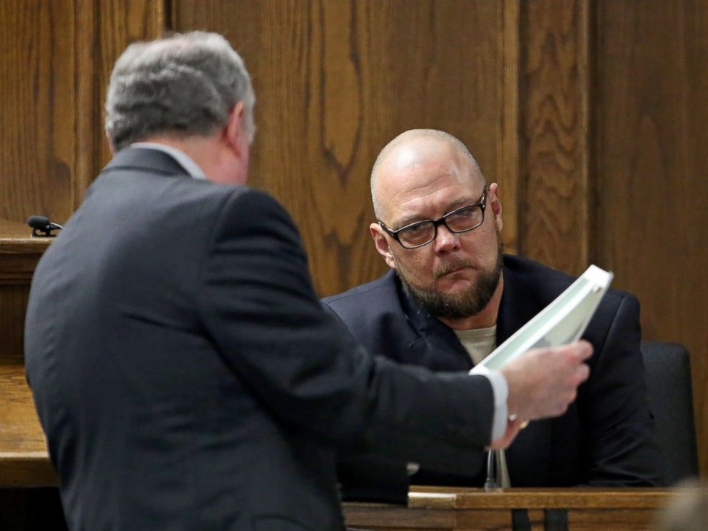 PHOTO: Court appointed defense attorney Tim Moore, left, shows James Watson, uncle to ex-Marine Eddie Ray Routh, photographs that are evidence from Routh's house during testimony in Routh's capital murder trial in Stephenville, Texas, Feb. 13, 2015. 