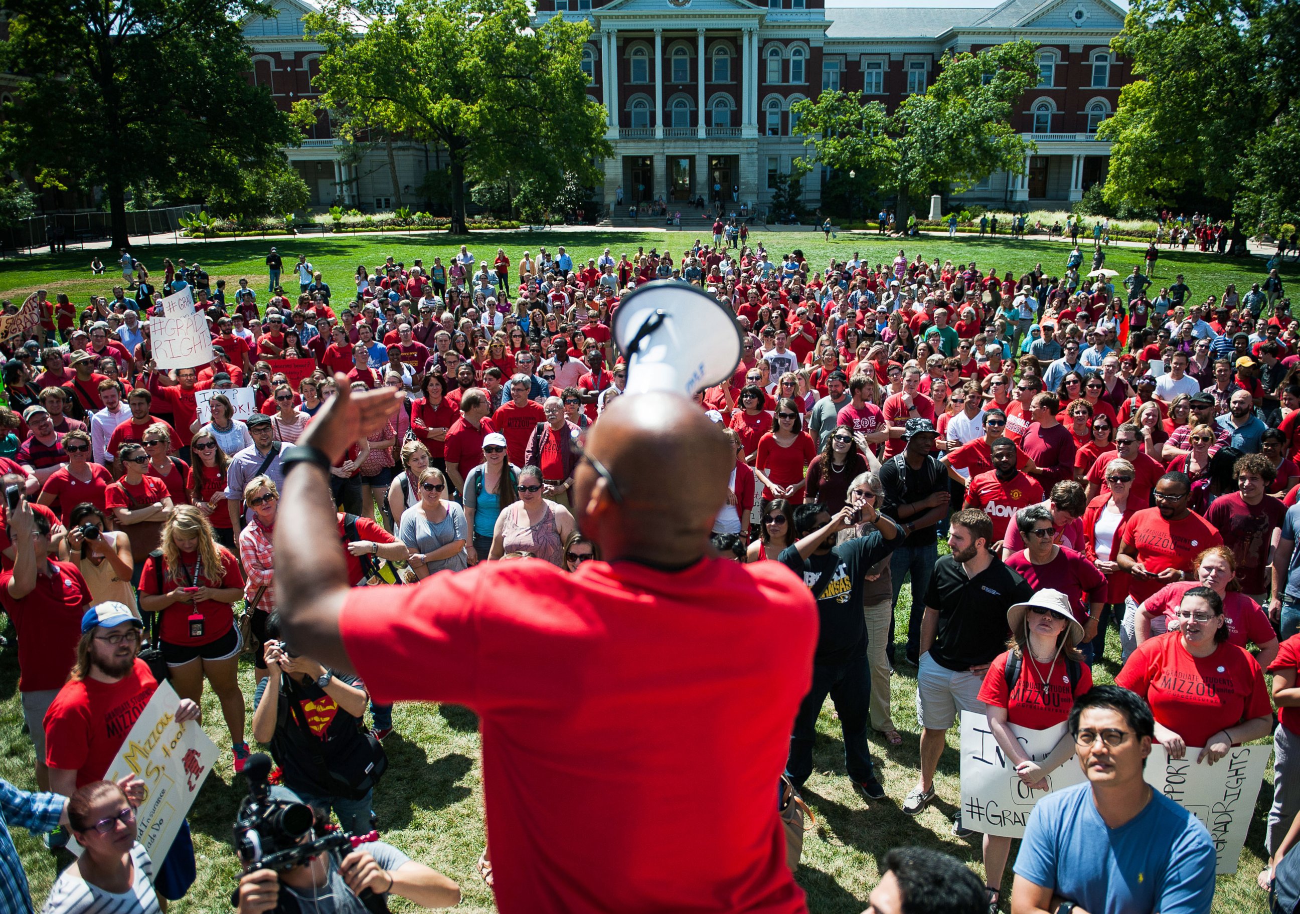 PHOTO: Jonathan Butler encourages a crowd to scream while using a megaphone during a "day of action" to celebrate graduate students and draw attention to demands on Aug. 26, 2015, near the columns on the University of Missouri campus, in Columbia, Mo.