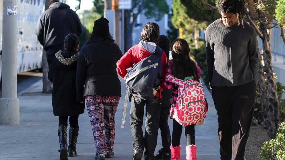 PHOTO: Parents take their children home from school early, Dec. 15, 2015, in Los Angeles.