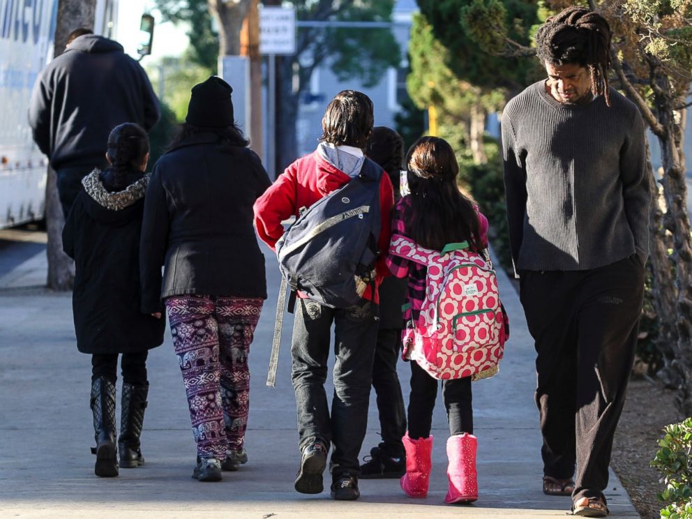 PHOTO: Parents take their children home from school early, Dec. 15, 2015, in Los Angeles.