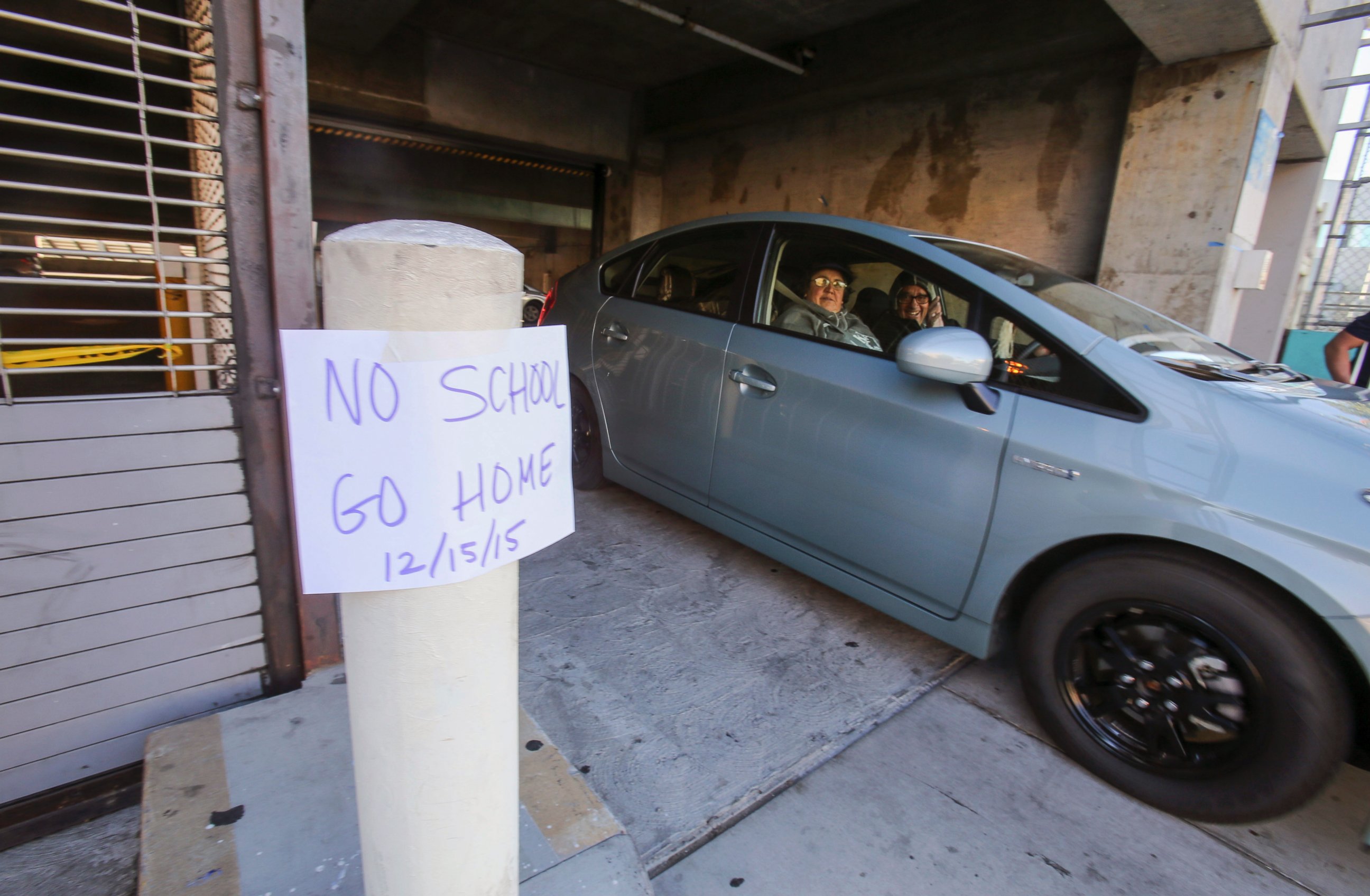 PHOTO: A vehicle leaves the Miguel Contreras Learning Complex past a sign that reads "No School Go Home," Dec. 15, 2015, in Los Angeles.
