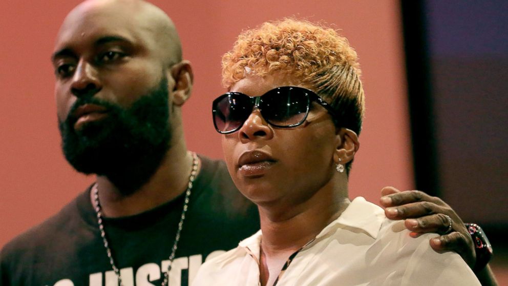 PHOTO: Michael Brown Sr. and Lesley McSpadden listen to a speaker during a rally on Aug. 17, 2014, for their son who was killed by police last Saturday in Ferguson, Mo.