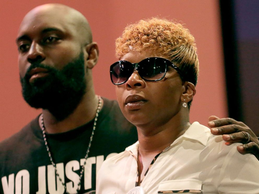 PHOTO: Michael Brown Sr. and Lesley McSpadden listen to a speaker during a rally on Aug. 17, 2014, for their son who was killed by police last Saturday in Ferguson, Mo.