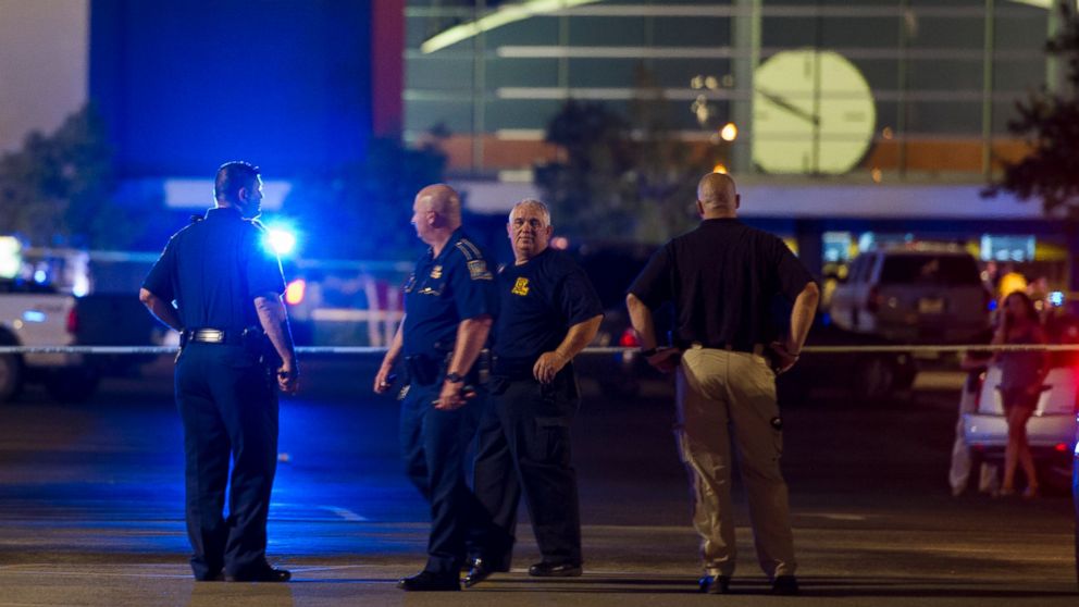 PHOTO: Law enforcement personnel stand near a police line at The Grand Theatre following a deadly shooting in Lafayette, La., July 23, 2015. 