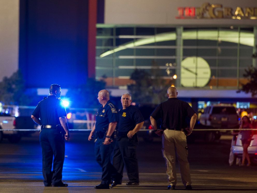 PHOTO: Law enforcement personnel stand near a police line at The Grand Theatre following a deadly shooting in Lafayette, La., July 23, 2015.