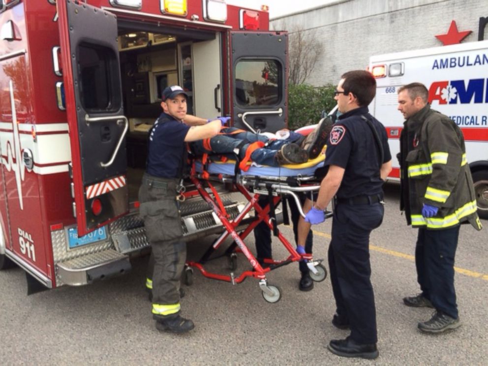 PHOTO: The suspect in a series of stabbings is transported on a gurney into an ambulance by medical personnel at the Silver City Galleria mall in Taunton, Mass., May 10, 2016.