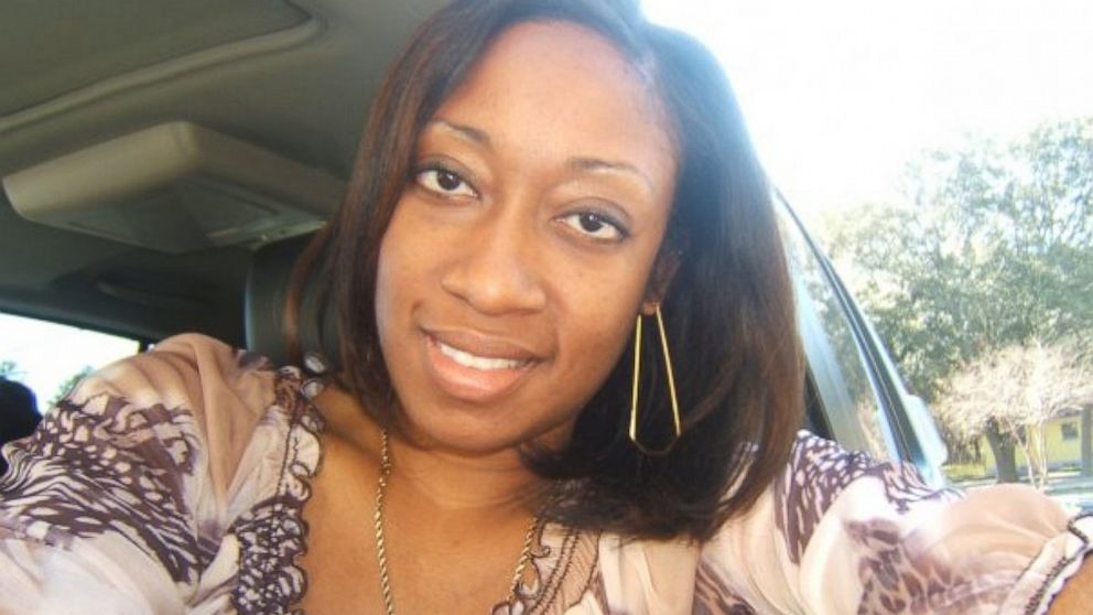 This undated family photo provided by Lincoln B. Alexander shows Marissa Alexander in her car in Tampa, Fla.