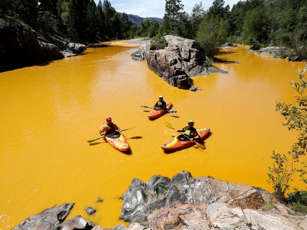 PHOTO: People kayak in the Animas River near Durango, Colo., Aug. 6, 2015, in water colored from a mine waste spill.