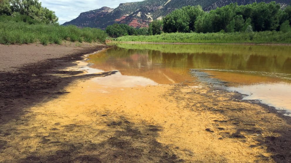 PHOTO: As the Animas River begins to recede it reveals a sludge left behind by the Gold King Mine spillage just north of Durango Colo. on Aug. 7, 2015.