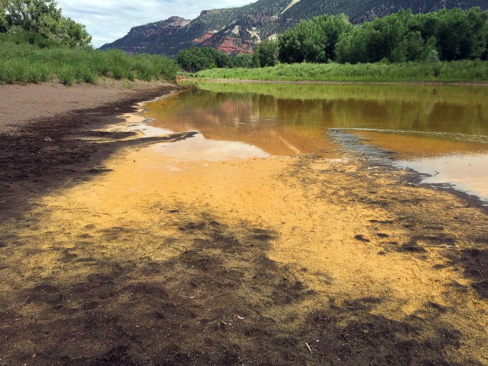 PHOTO: As the Animas River begins to recede it reveals a sludge left behind by the Gold King Mine spillage just north of Durango Colo. on Aug. 7, 2015.