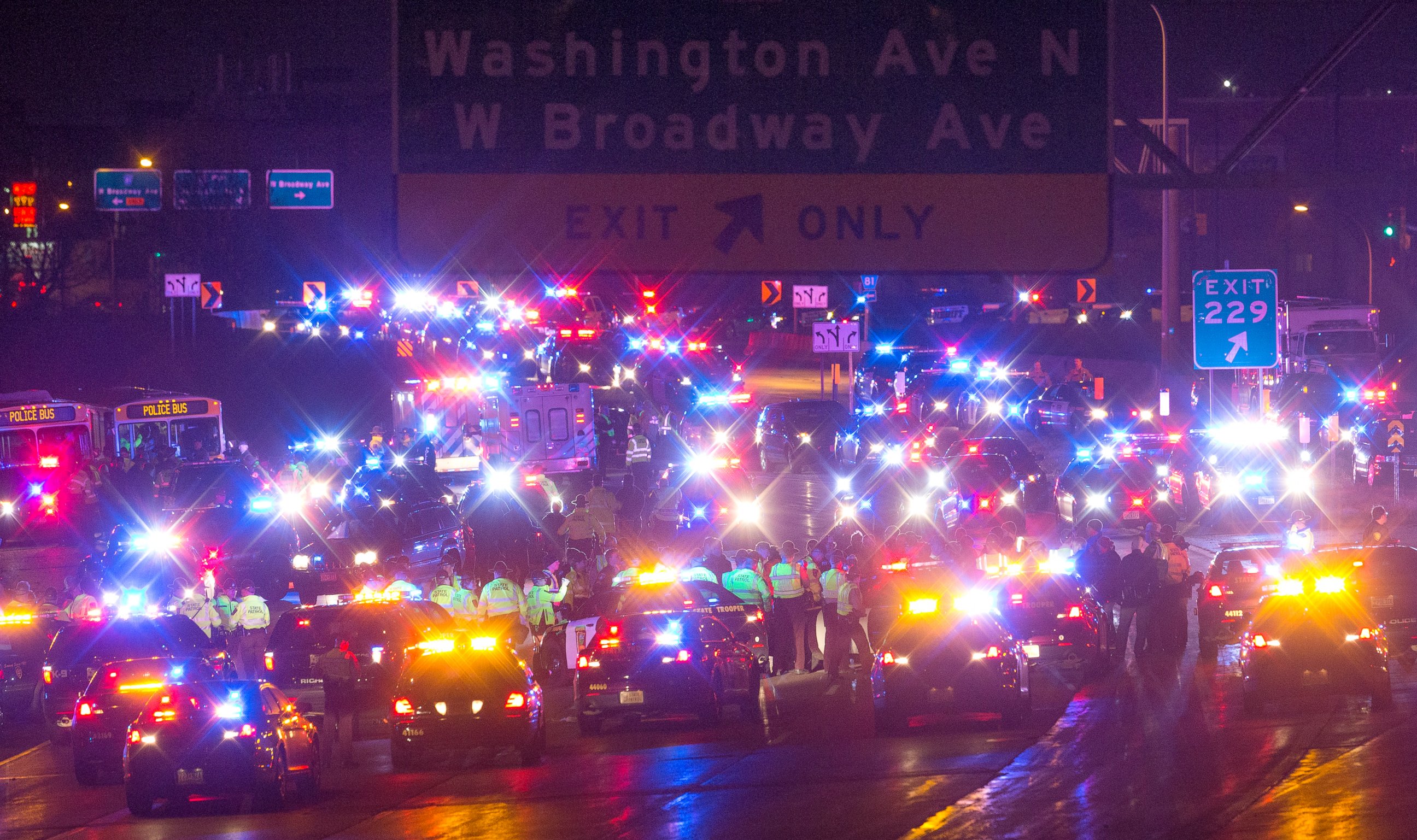 PHOTO: Demonstrators are surrounded and arrested by police after blocking a portion of Interstate 94, shutting down the northbound lanes, Nov. 16, 2015, in Minneapolis. 