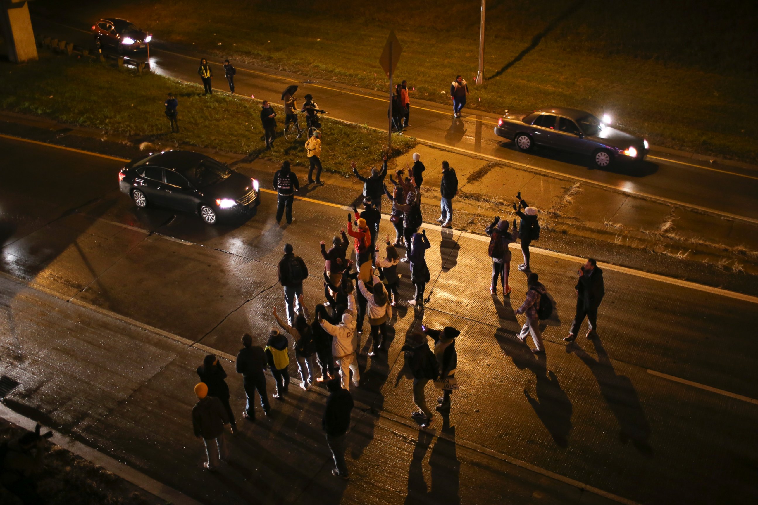 PHOTO: Marchers stop traffic on an entrance ramp to westbound Interstate 94 before moving to the main freeway, Nov. 16, 2015, in Minneapolis.