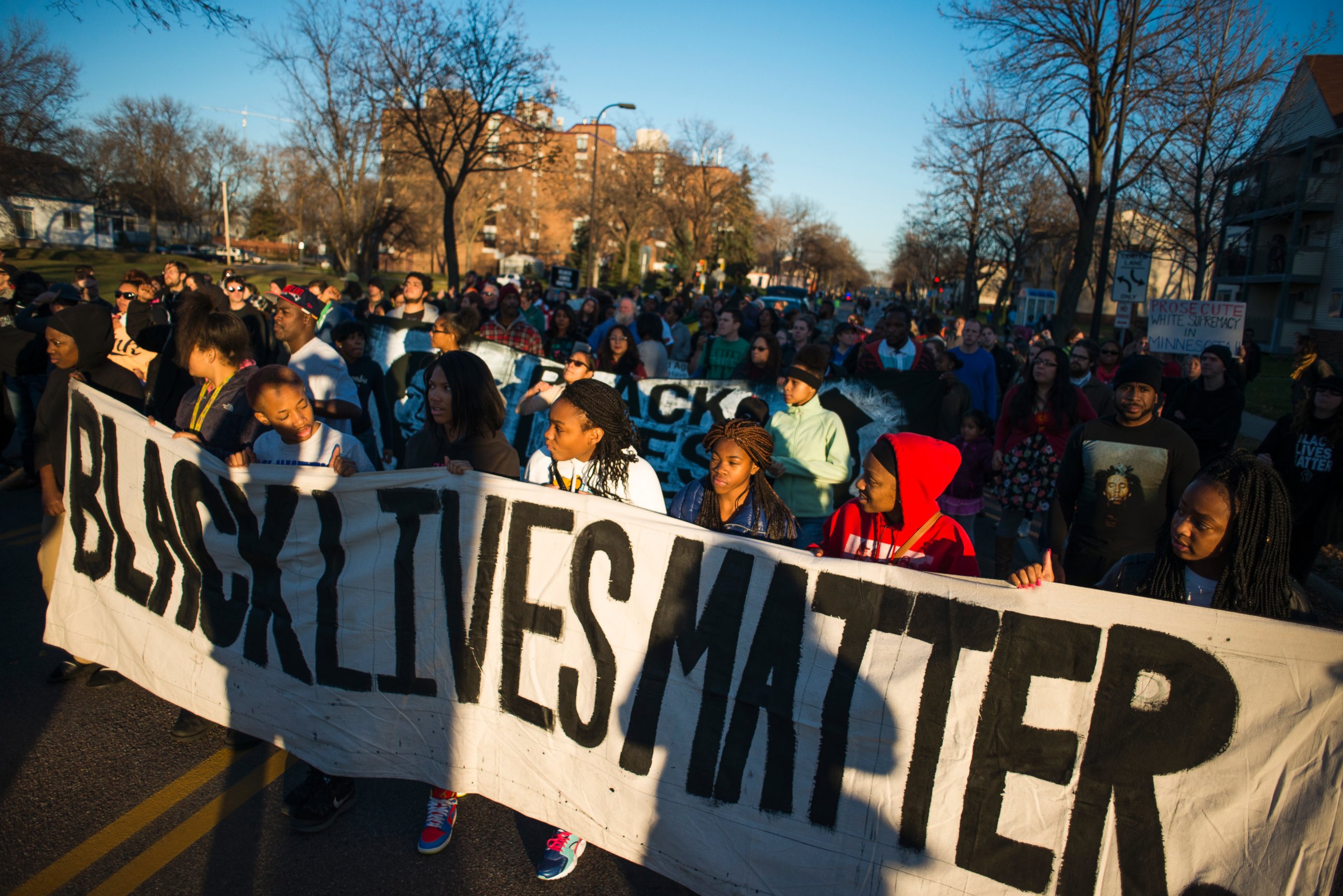 PHOTO: Neighbors and community members gathered at the scene where a man was shot and wounded by a Minneapolis Police officer early Sunday, Nov. 15, 2015. 