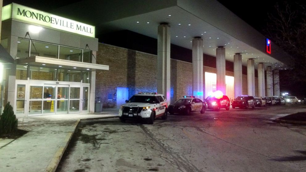 Police vehicles line up outside Monroeville (Pa) Mall Saturday, Feb. 7 2015, after a shooting took place inside. As many as three people were injured.