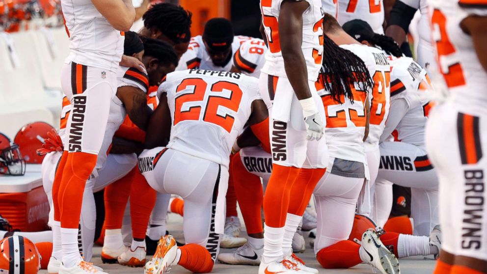 This Aug. 21, 2017 file photo shows members of the Cleveland Browns kneeling during the national anthem before an NFL preseason football game between the New York Giants and the Cleveland Browns in Cleveland.