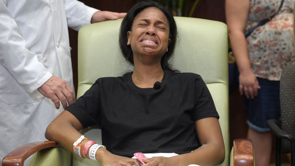 Patience Carter, a victim in the Pulse nightclub shooting from Philadelphia, becomes emotional after giving her story during a news conference at Florida Hospital Orlando, June 14, 2016, in Orlando, Fla.