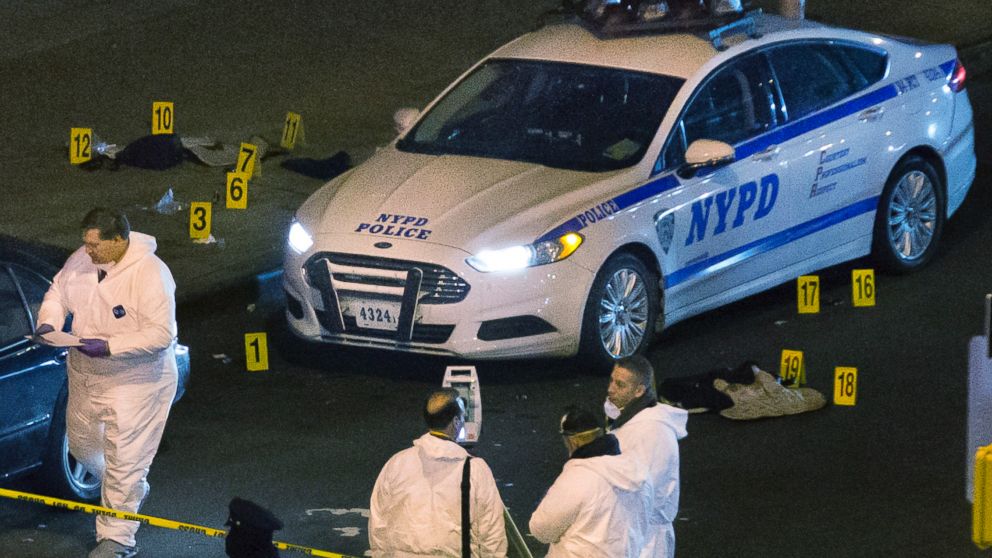 PHOTO: Bulletproof vests lie on each side of an NYPD patrol car as investigators work at the scene where two NYPD officers were shot in the Bedford-Stuyvesant neighborhood of the Brooklyn borough of New York on Saturday, Dec. 20, 2014.