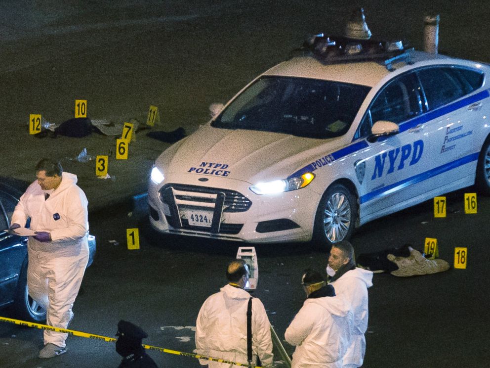PHOTO: Bulletproof vests lie on each side of an NYPD patrol car as investigators work at the scene where two NYPD officers were shot in the Bedford-Stuyvesant neighborhood of the Brooklyn borough of New York on Saturday, Dec. 20, 2014.
