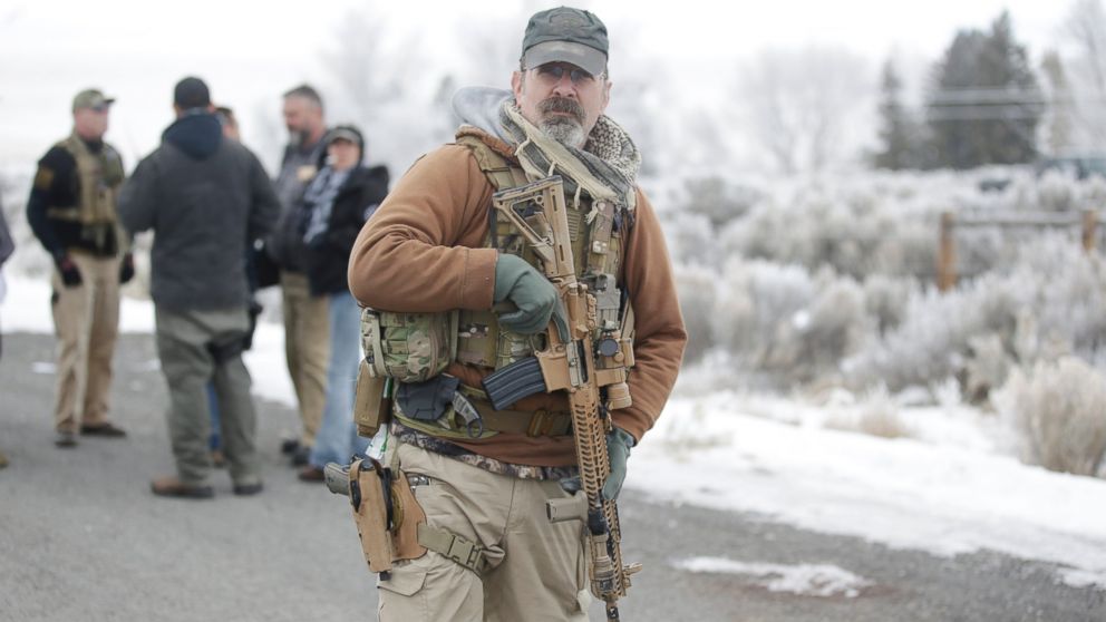 A man stands guard after members of the "3% of Idaho" group along with several other organizations arrived at the Malheur National Wildlife Refuge near Burns, Ore., on Saturday, Jan. 9, 2016.