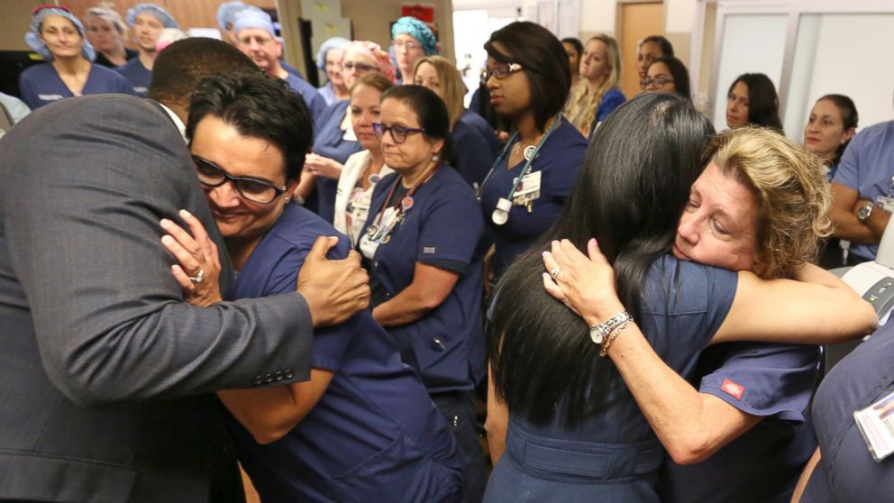 PHOTO: Doctors, nurses and first-responders hug after a brief prayer service in the emergency room at Florida Hospital in Orlando, Fla., June 15, 2016, to honor the victims of the Pulse nightclub mass shooting.