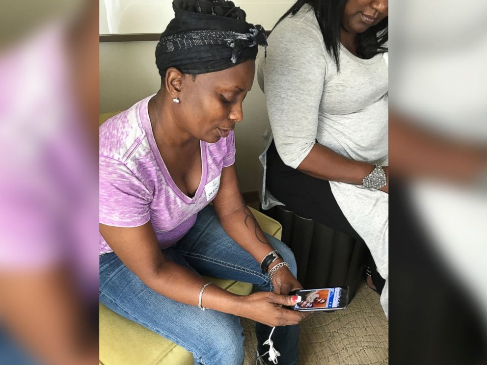 PHOTO: Mina Justice speaks to a reporter about texting with her son Eddie Justice who was in a bathroom at Club Pulse, June, 12, 2016, in Orlando.