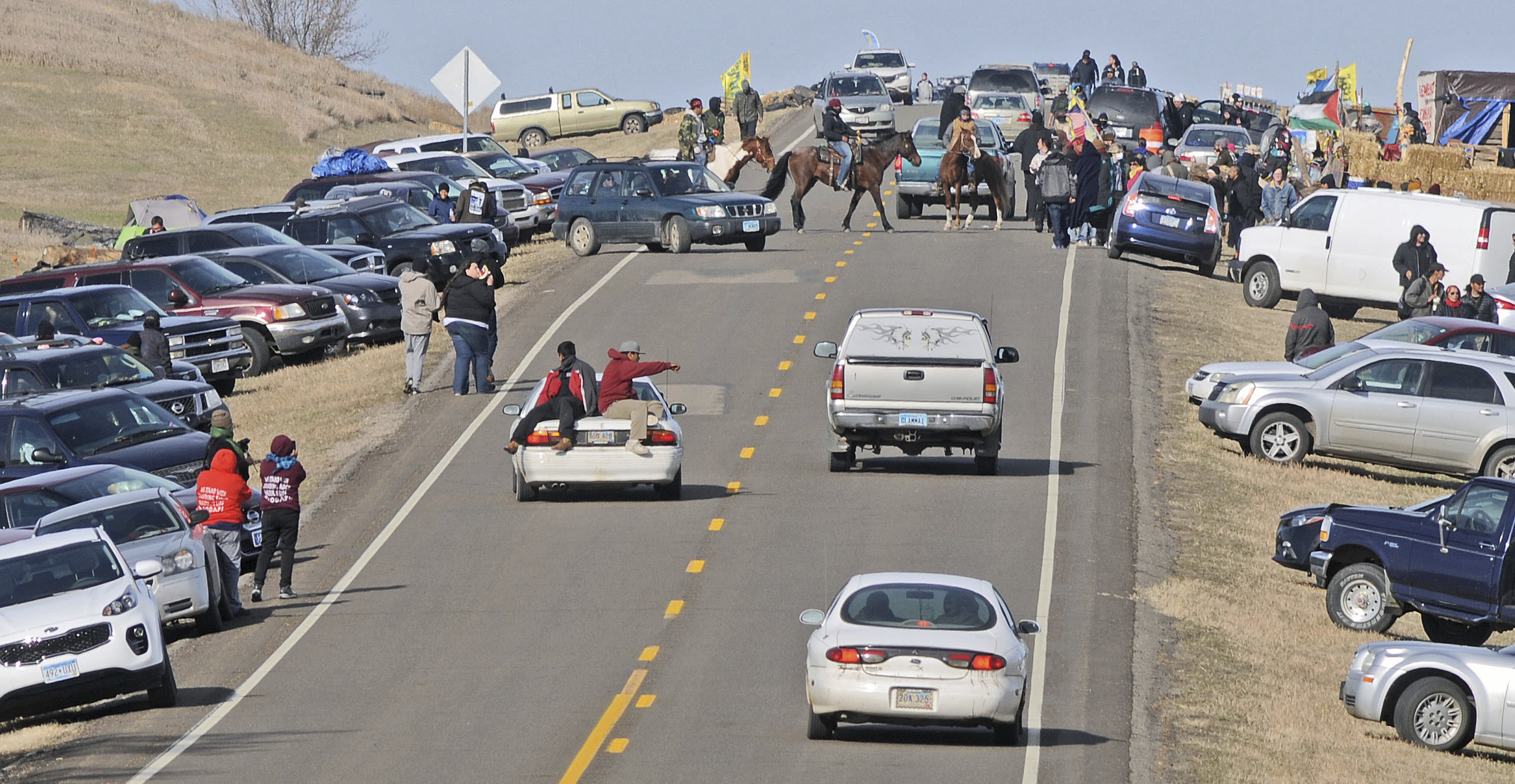 PHOTO: People protesting the Dakota Access Pipeline gather along North Dakota Highway 1806 in Morton County at the site of a new camp that was being put together, Oct. 24, 2016, in Cannonball, North Dakota.