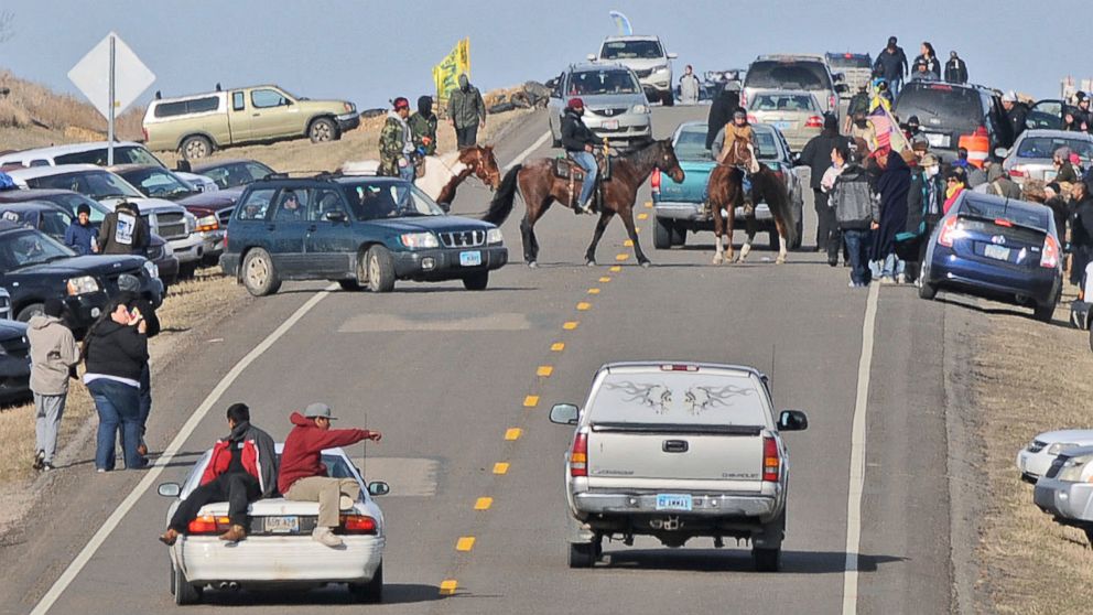 PHOTO: People protesting the Dakota Access Pipeline gather along North Dakota Highway 1806 in Morton County at the site of a new camp that was being put together, Oct. 24, 2016, in Cannonball, North Dakota.