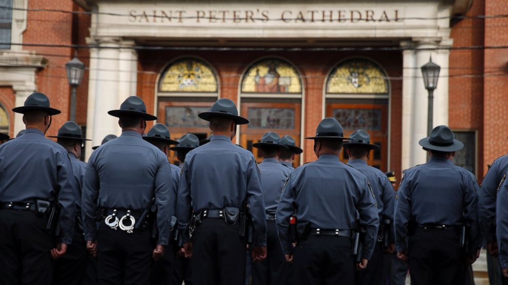PHOTO: Law enforcement officers gather outside before a funeral service for Pennsylvania State Trooper Cpl. Bryon Dickson, Sept. 18, 2014, in Scranton, Pa.