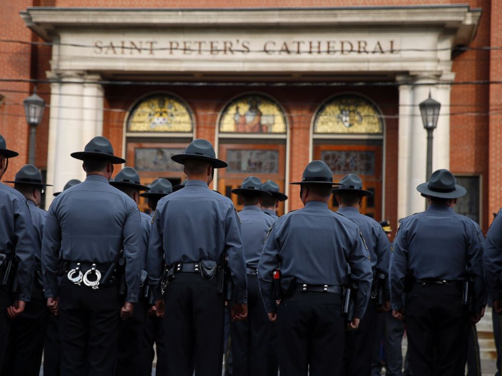 PHOTO: Law enforcement officers gather outside before a funeral service for Pennsylvania State Trooper Cpl. Bryon Dickson, Sept. 18, 2014, in Scranton, Pa.