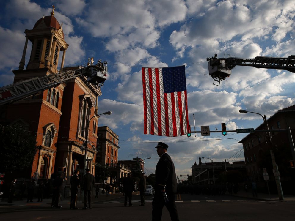 PHOTO: A law enforcement officer arrives for a funeral service for Pennsylvania State Trooper Cpl. Bryon Dickson, Sept. 18, 2014, in Scranton, Pa.