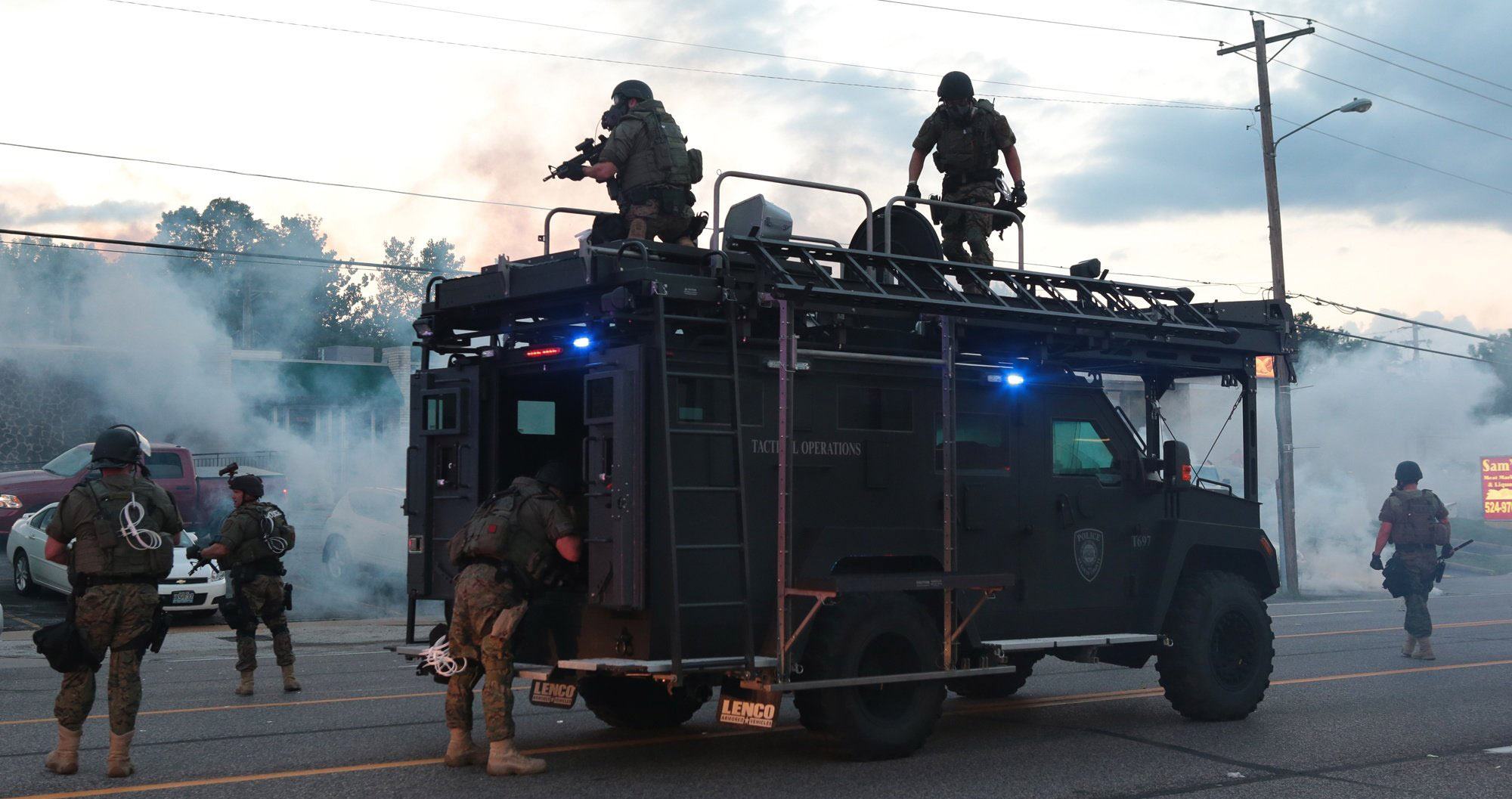 PHOTO: Tactical officers fire tear gas on Monday, Aug. 11, 2014, in Ferguson, Mo.