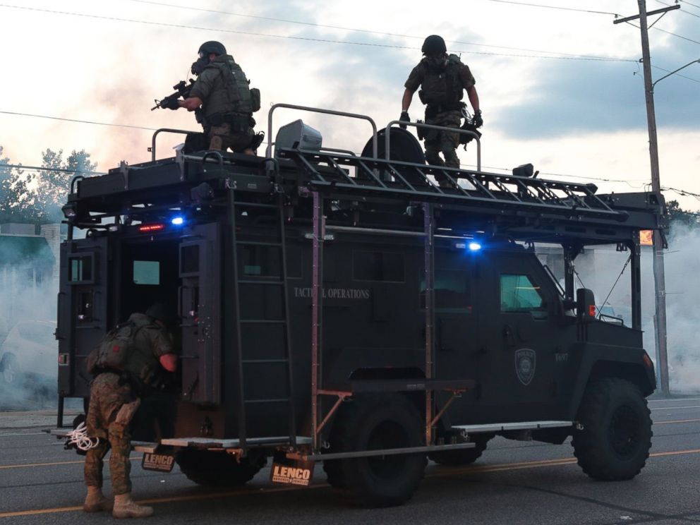 PHOTO: Tactical officers fire tear gas on Monday, Aug. 11, 2014, in Ferguson, Mo.