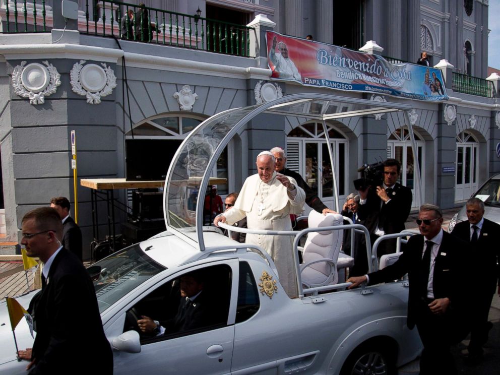 PHOTO: Security surrounds Pope Francis popemobile as he makes his way to the Metropolitan Cathedral to celebrate Mass in Santiago de Cuba, Cuba, Sept. 22, 2015.