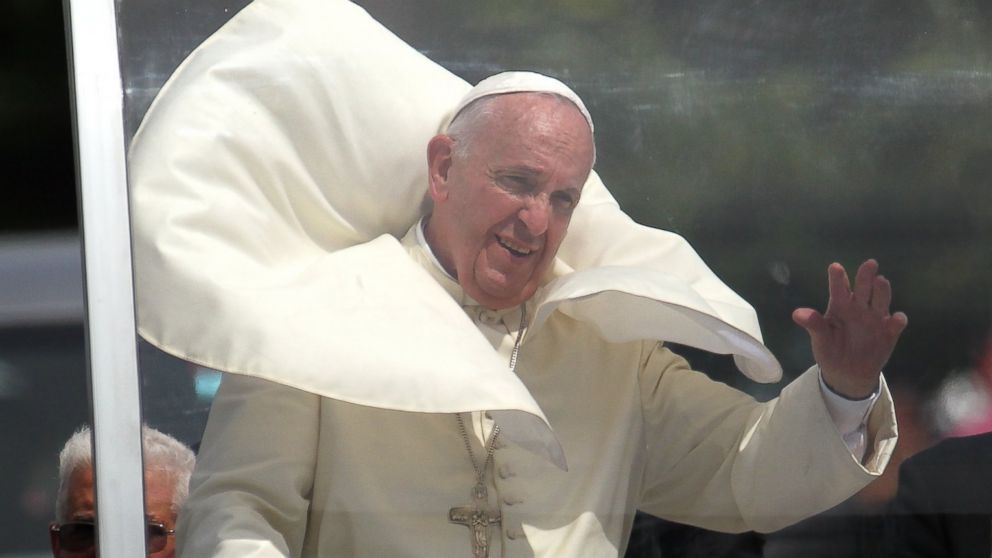 Pope Francis waves from his popemobile as he makes his way to the airport in Santiago de Cuba, Cuba, Sept. 22, 2015.