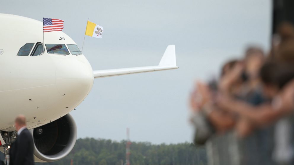 PHOTO: A crowd waves to a plane carrying Pope Francis as he arrives at Andrews Air Force Base, Md., Sept. 22, 2015.
