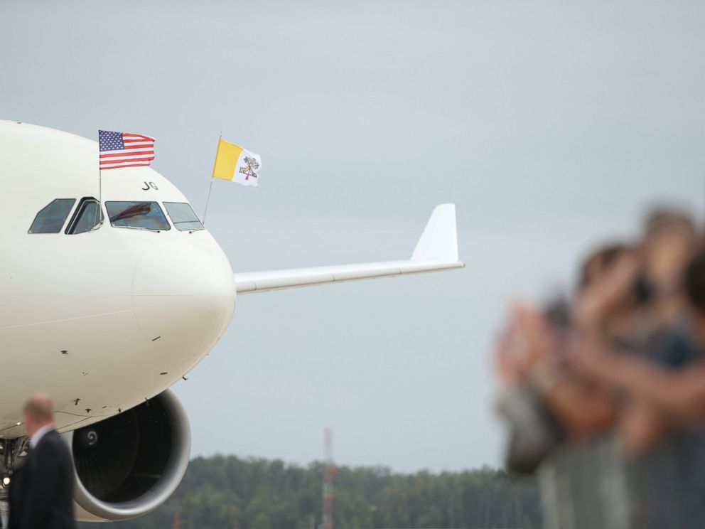PHOTO: A crowd waves to a plane carrying Pope Francis as he arrives at Andrews Air Force Base, Md., Sept. 22, 2015.