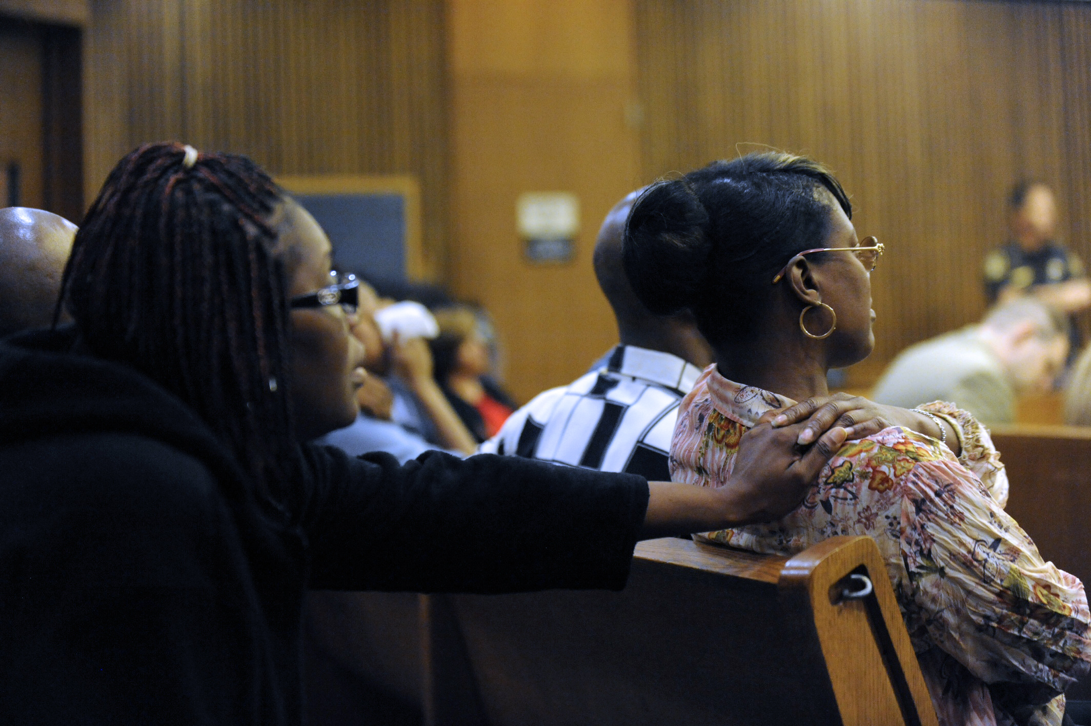 PHOTO: Monica McBride, right, reacts to photos of her deceased daughter during the Theodore Wafer trial in Detroit on July 24, 2014.