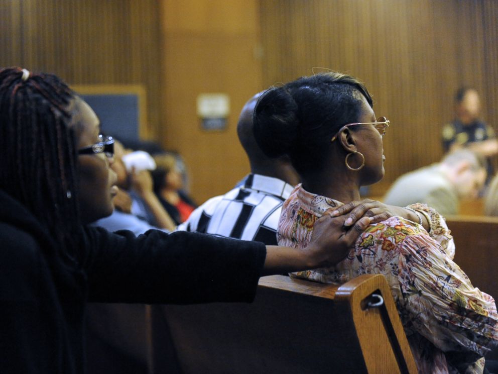 PHOTO: Monica McBride, right, reacts to photos of her deceased daughter during the Theodore Wafer trial in Detroit on July 24, 2014.