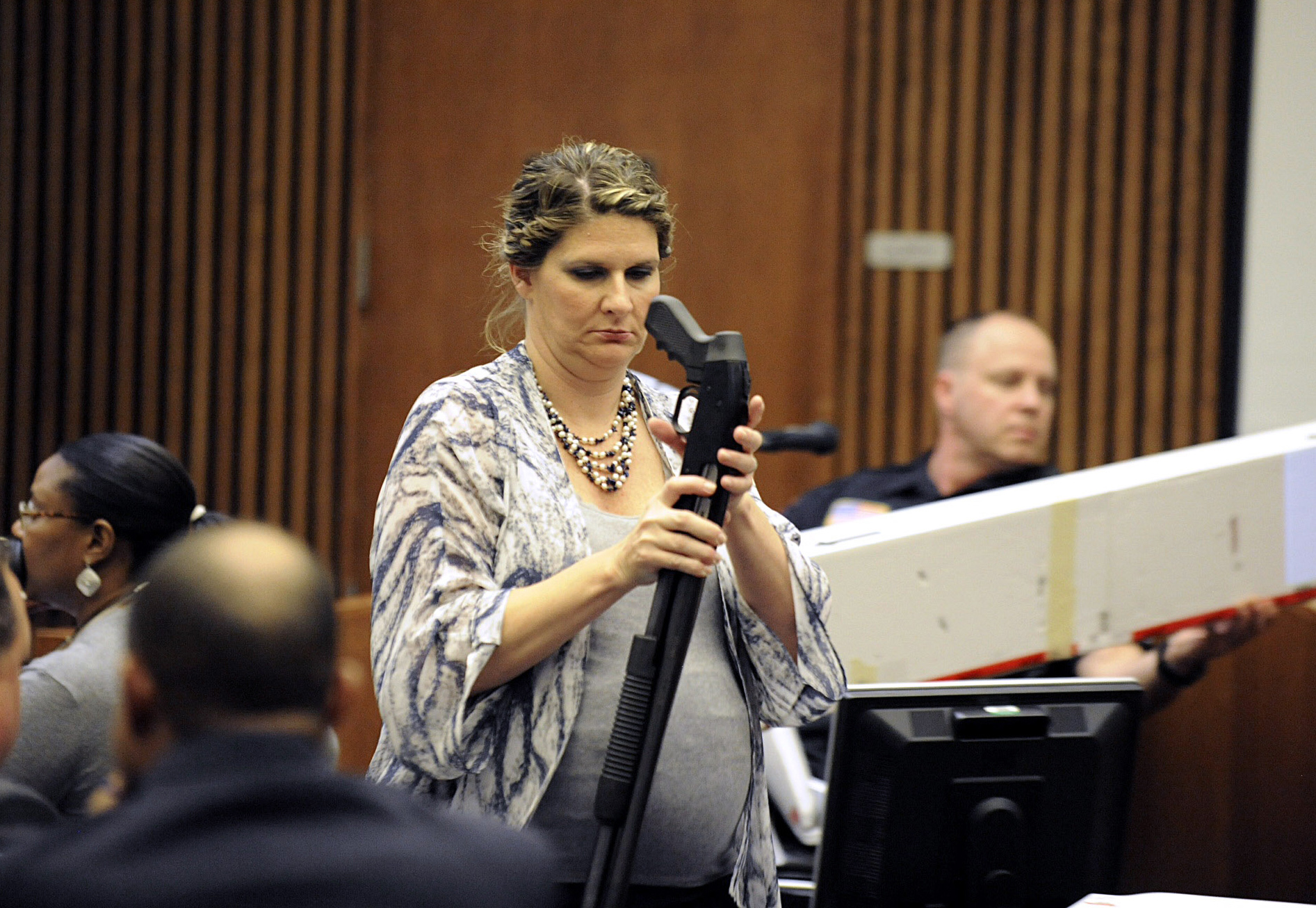 PHOTO: Wayne County Assistant Prosecutor Danielle Hagaman-Clark holds the gun used to kill Renisha McBride during the Theodore Wafer trial in Detroit on July 24, 2014.