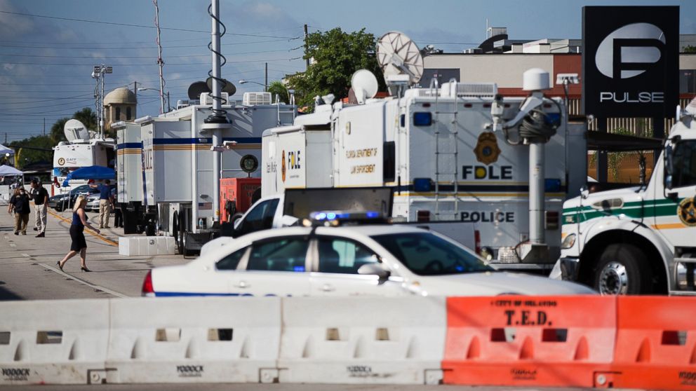 PHOTO: Law enforcement mobile command vehicles line the street next to the scene of the Pulse nightclub mass shooting, June 16, 2016, in Orlando, Fla.