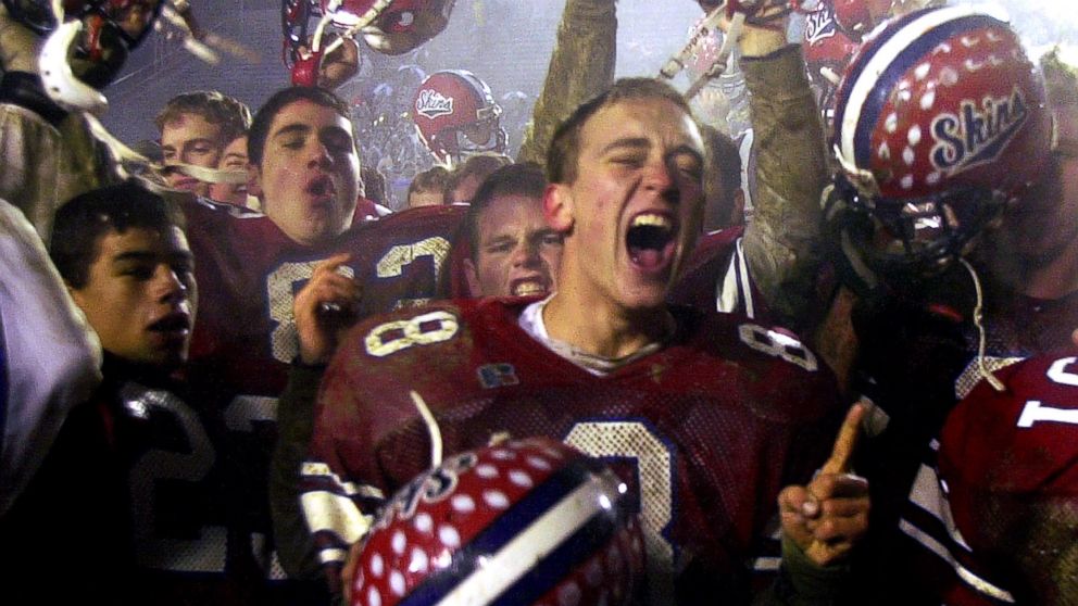 FILE - In this Dec. 8, 2001 file photo, Neshaminy quarterback Jason Waiter, center, celebrates with teammates after their 21-7 victory over Woodland Hills to claim the Class AAAA state title in Hershey, Pa.  Student editors have voted to ban the words "Redskins" ? the school mascot at football-crazed Neshaminy.(AP Photo/Chris Gardner)