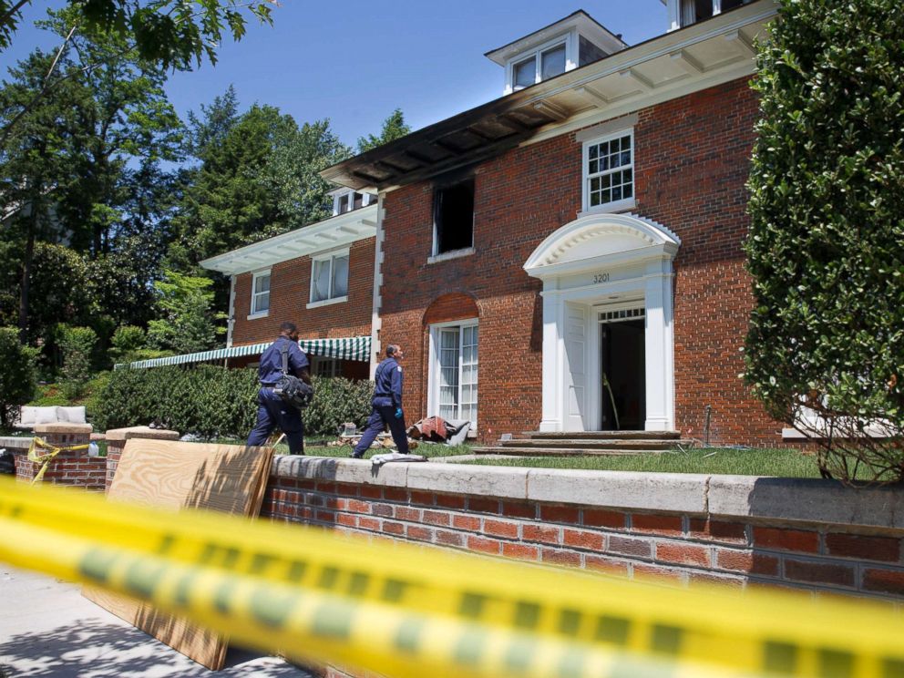PHOTO: Police work the scene of a fire-damaged multimillion-dollar home in northwest Washington home, May 22, 2015, where 46-year-old Savvas Savopoulos, his wife, the couples 10-year-old son Philip, and housekeeper were found dead.