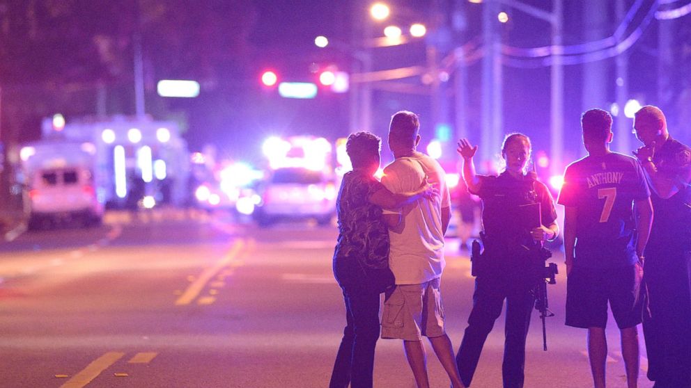 PHOTO: Orlando Police officers direct family members away from a multiple shooting at a nightclub in Orlando, Fla., Sunday, June 12, 2016.