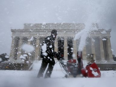 PHOTO: A Park Service employee clears snow in front of the Lincoln Memorial in Washington, Feb. 13, 2014.