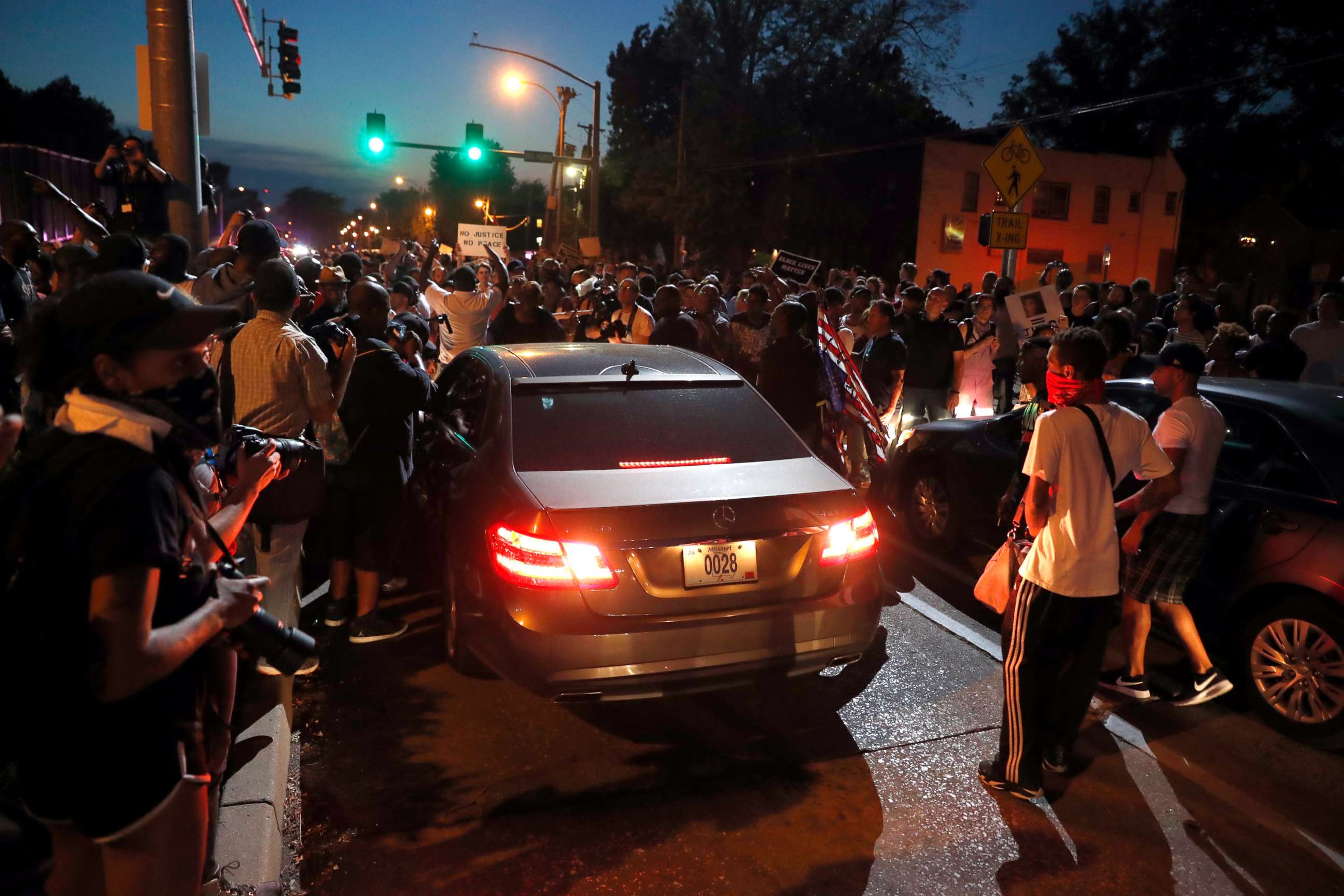 PHOTO: Protesters surround a car as they march in the street response to a not guilty verdict in the trial of former St. Louis police officer Jason Stockley Saturday, Sept. 16, 2017, in St. Louis.