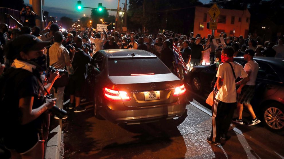 PHOTO: Protesters surround a car as they march in the street response to a not guilty verdict in the trial of former St. Louis police officer Jason Stockley Saturday, Sept. 16, 2017, in St. Louis.