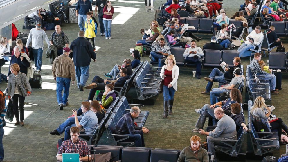 PHOTO: On the busiest travel day of the year, passengers wait for flights inside a terminal at Denver International Airport, Nov. 27, 2013. 