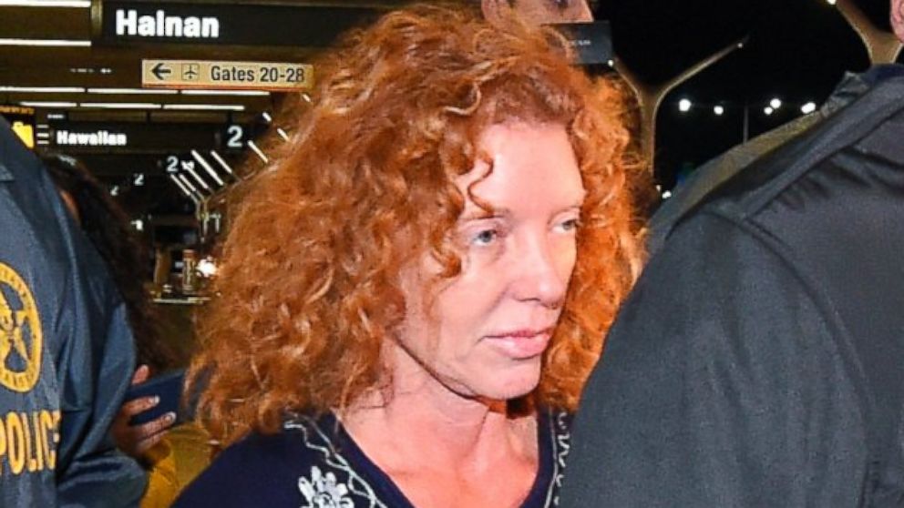 PHOTO: Tonya Couch is taken by authorities to a waiting car after arriving at Los Angeles International Airport, Dec. 31, 2015, in Los Angeles.