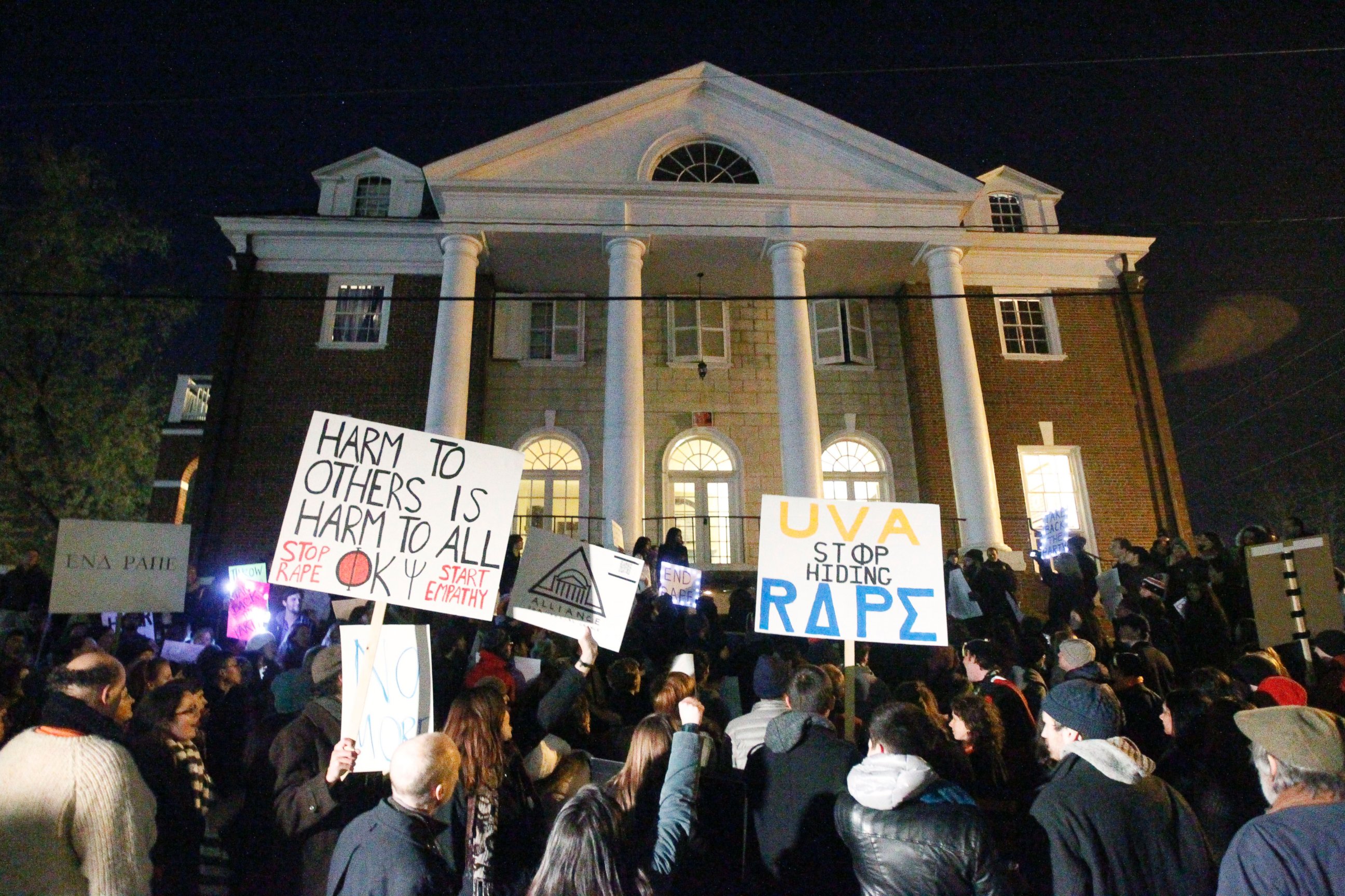 PHOTO: Protestors carry signs and chant slogans in front of the Phi Kappa Psi fraternity house at the University of Virginia, Nov. 22, 2014, in Charlottesville, Va.